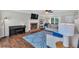 Cozy living area with a brick fireplace, hardwood flooring, and comfortable seating at 1293 Wynford Colony Sw, Marietta, GA 30064