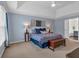 Main bedroom with tray ceilings and carpeted floors at 1293 Wynford Colony Sw, Marietta, GA 30064