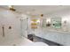 Luxury bathroom featuring a glass enclosed shower, double vanity and gold fixtures at 1533 Grayson Pkwy, Grayson, GA 30017