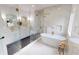 Stunning bathroom featuring a soaking tub, glass shower, and marble countertops at 1533 Grayson Pkwy, Grayson, GA 30017