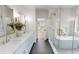 Elegant bathroom showcasing a freestanding tub, glass shower, and double sinks at 1533 Grayson Pkwy, Grayson, GA 30017