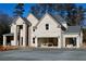 New construction two-story brick home showing driveway and garage, perfect for a growing Gathering at 1533 Grayson Pkwy, Grayson, GA 30017