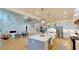 Modern gourmet kitchen with an island and stainless steel appliances, open to the living area and fireplace at 1533 Grayson Pkwy, Grayson, GA 30017