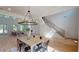 Spacious open concept design with living, dining, and staircase flowing seamlessly together with views to the modern kitchen at 1533 Grayson Pkwy, Grayson, GA 30017