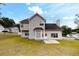 Spacious backyard featuring a two-story house, bay window, and ample space for outdoor activities at 3068 River Oak Rd, Decatur, GA 30034