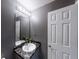Charming bathroom vanity, white fixtures, and a well-lit mirror at 3068 River Oak Rd, Decatur, GA 30034
