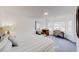 Bright, spacious bedroom with large windows, a comfortable chair and work space at 3068 River Oak Rd, Decatur, GA 30034