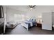 Spacious bedroom featuring a queen bed, gray sofa near the window, offering a light-filled and comfortable atmosphere at 3068 River Oak Rd, Decatur, GA 30034