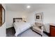 This charming bedroom has a bed, a cushioned chair, and classic decor, creating a cozy and inviting space at 3068 River Oak Rd, Decatur, GA 30034