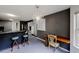 Open-concept kitchen area with bar seating, chandelier lighting and workspace at 3068 River Oak Rd, Decatur, GA 30034