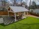 Aerial view of the cabana with fireplace and outdoor seating at 3125 Peachtree Ne Dr, Atlanta, GA 30305