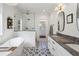 Luxurious bathroom featuring a standalone tub, walk-in shower, and double vanity sinks at 3125 Peachtree Ne Dr, Atlanta, GA 30305