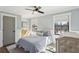 Bedroom with a ceiling fan, wood floors, two windows and blue bedding at 3125 Peachtree Ne Dr, Atlanta, GA 30305