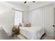 Cozy bedroom featuring shiplap walls, a vaulted ceiling, and a neutral color scheme at 3125 Peachtree Ne Dr, Atlanta, GA 30305