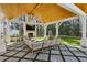 Outdoor cabana featuring wood ceiling, fireplace, TV, and patio seating at 3125 Peachtree Ne Dr, Atlanta, GA 30305