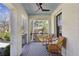 Inviting front porch features comfortable seating and a stylish black and white rug at 3125 Peachtree Ne Dr, Atlanta, GA 30305