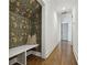 Entryway with hardwood floors, wallpapered alcove with a bench, and modern trim throughout at 3125 Peachtree Ne Dr, Atlanta, GA 30305