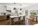 Eat-in kitchen featuring shaker cabinets, a marble countertop island, and modern lighting at 3125 Peachtree Ne Dr, Atlanta, GA 30305