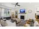 The bright living room includes a fireplace, comfortable seating, and seamless flow to the kitchen at 3125 Peachtree Ne Dr, Atlanta, GA 30305