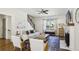 Bright living room with a fireplace, modern furniture, and lots of natural light at 3125 Peachtree Ne Dr, Atlanta, GA 30305