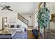 Stylish living room boasts modern decor, an elegant staircase, and hardwood floors at 3125 Peachtree Ne Dr, Atlanta, GA 30305