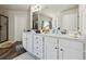 Bathroom featuring double sink vanity with hardwood floors and walk in shower at 4954 Zoya Sw Ct, Atlanta, GA 30331