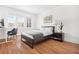 Bedroom featuring a bed, desk, and chair with natural light from the windows at 1007 S Candler St, Decatur, GA 30030