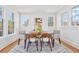 Bright dining room with modern table, six chairs and natural light at 1007 S Candler St, Decatur, GA 30030