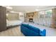 Comfortable living room with stone fireplace, a blue sofa, and bright, natural light at 1007 S Candler St, Decatur, GA 30030