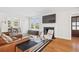 Cozy living room featuring a fireplace, hardwood floors, and comfortable seating at 1007 S Candler St, Decatur, GA 30030