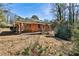 View of backyard featuring a covered patio and brick home and mature landscaping at 1269 Lawndale Ct, Decatur, GA 30032