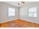 Bedroom with hardwood floors, ceiling fan and large windows with natural light at 1269 Lawndale Ct, Decatur, GA 30032