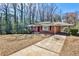 Charming brick home featuring a covered parking area and driveway at 1269 Lawndale Ct, Decatur, GA 30032