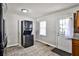 Kitchen featuring tile floors, a washer and dryer unit, access to the backyard, and light walls at 1269 Lawndale Ct, Decatur, GA 30032