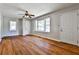 Bright living room featuring hardwood floors, white trim, and a large window for ample natural light at 1269 Lawndale Ct, Decatur, GA 30032