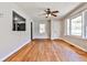 Bright living room featuring hardwood floors, a ceiling fan, and two bright windows at 1269 Lawndale Ct, Decatur, GA 30032