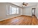 Bright living room with hardwood floors, ceiling fan, and natural light from the window at 1269 Lawndale Ct, Decatur, GA 30032