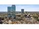 Stunning aerial view of a high-rise building surrounded by lush greenery and cityscape, with an adjacent church at 2828 Peachtree Nw Rd # 1701, Atlanta, GA 30305