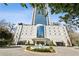 Low angle shot of the building with a circular driveway and tiered water fountain at 2828 Peachtree Nw Rd # 1701, Atlanta, GA 30305