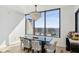 Bright dining area featuring a modern chandelier and floor-to-ceiling windows with scenic views at 2828 Peachtree Nw Rd # 1701, Atlanta, GA 30305