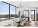 Dining area with natural light and panoramic city views at 2828 Peachtree Nw Rd # 1701, Atlanta, GA 30305