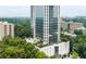 Stunning high-rise building featuring a rooftop pool and lush greenery, offering a luxurious urban oasis at 2828 Peachtree Nw Rd # 1701, Atlanta, GA 30305