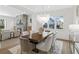 Dining room features hardwood floors, modern light fixture, lots of natural light, and an open floor plan at 52 25Th Nw St, Atlanta, GA 30309