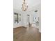 Elegant entryway with hardwood floors, a statement chandelier, and office view at 52 25Th Nw St, Atlanta, GA 30309