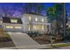 Stunning two-story home with a manicured lawn and an attached two-car garage at 52 25Th Nw St, Atlanta, GA 30309