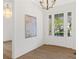 Bright foyer with hardwood floors, white walls, and a modern chandelier at 52 25Th Nw St, Atlanta, GA 30309