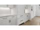 Kitchen featuring custom white cabinets, drawers, and bronze hardware at 52 25Th Nw St, Atlanta, GA 30309