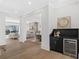 Open living space with a bar cabinet featuring a beverage fridge and hardwood floors at 52 25Th Nw St, Atlanta, GA 30309