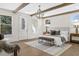 Bright and airy main bedroom with exposed beams, hardwood floors, and multiple windows at 52 25Th Nw St, Atlanta, GA 30309