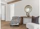 Bedroom seating area with a wooden table, neutral chairs, and modern decor at 52 25Th Nw St, Atlanta, GA 30309